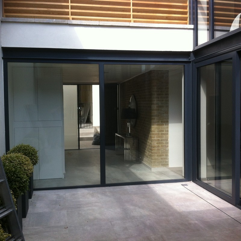 Floor-to-ceiling sliding doors opening to courtyard in Bermondsey
