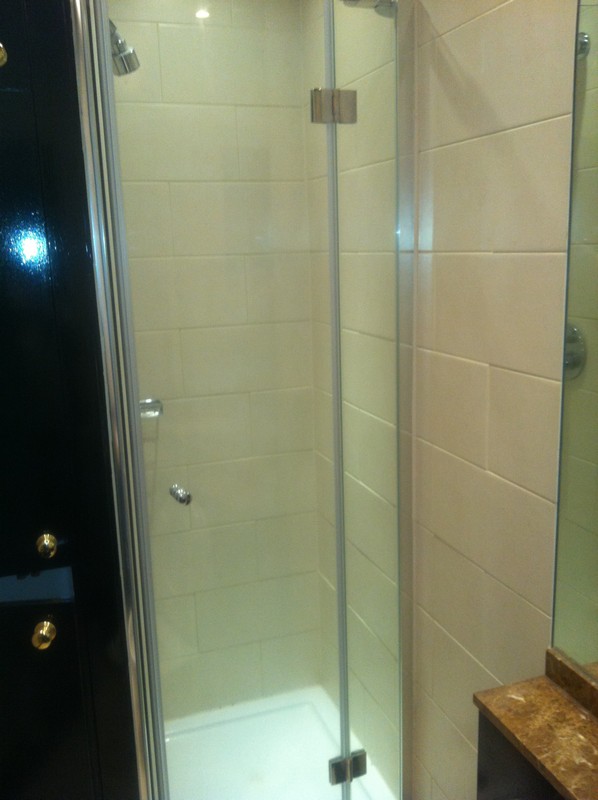 Frameless glass shower enclosure with chrome fittings in Bermondsey