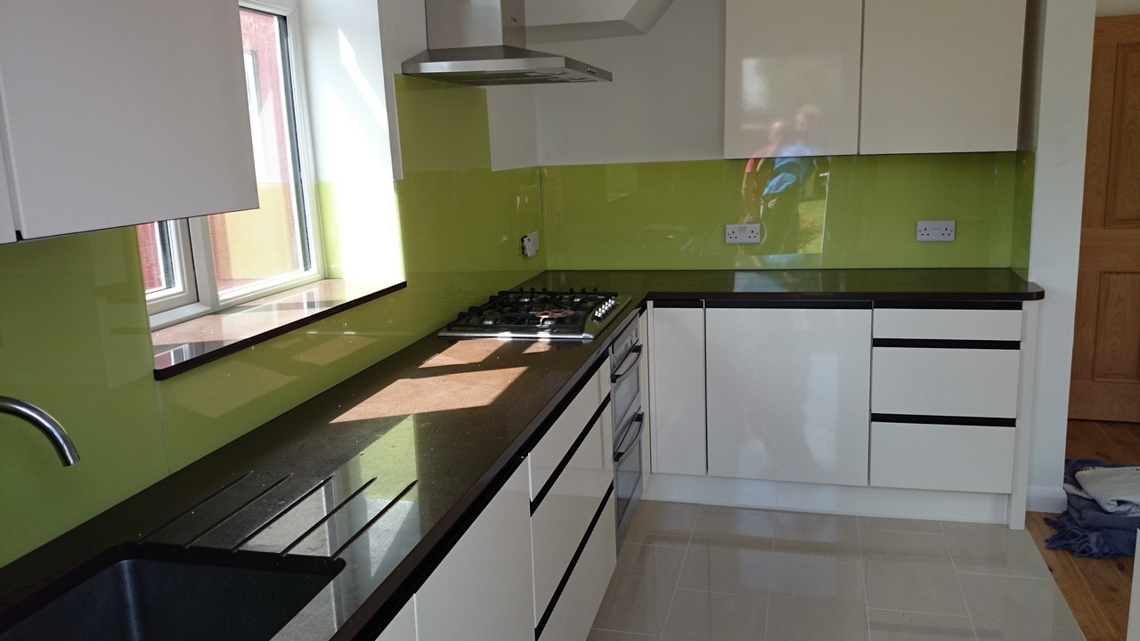 Lime green glass kitchen splashback installed by Bermondsey glaziers