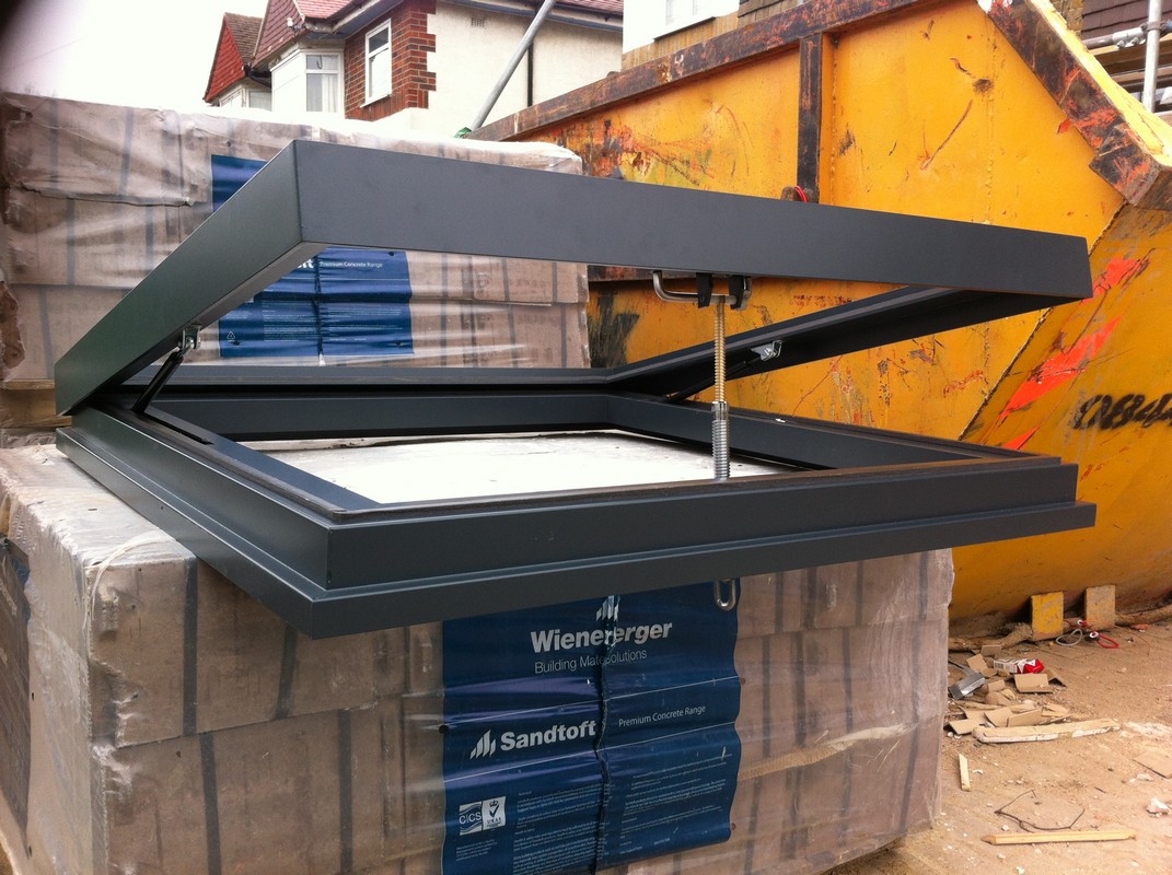 Opening flat roof skylight in anthracite grey installed in Bermondsey